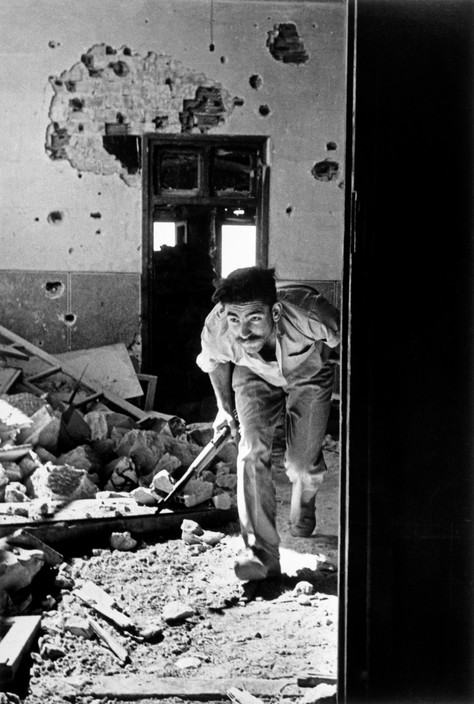 Robert Capa, Jerusalem. June 9th, 1948. A member of the Israeli government forces, the Haganah, in a building surrounding the old city, held by the Arabs.